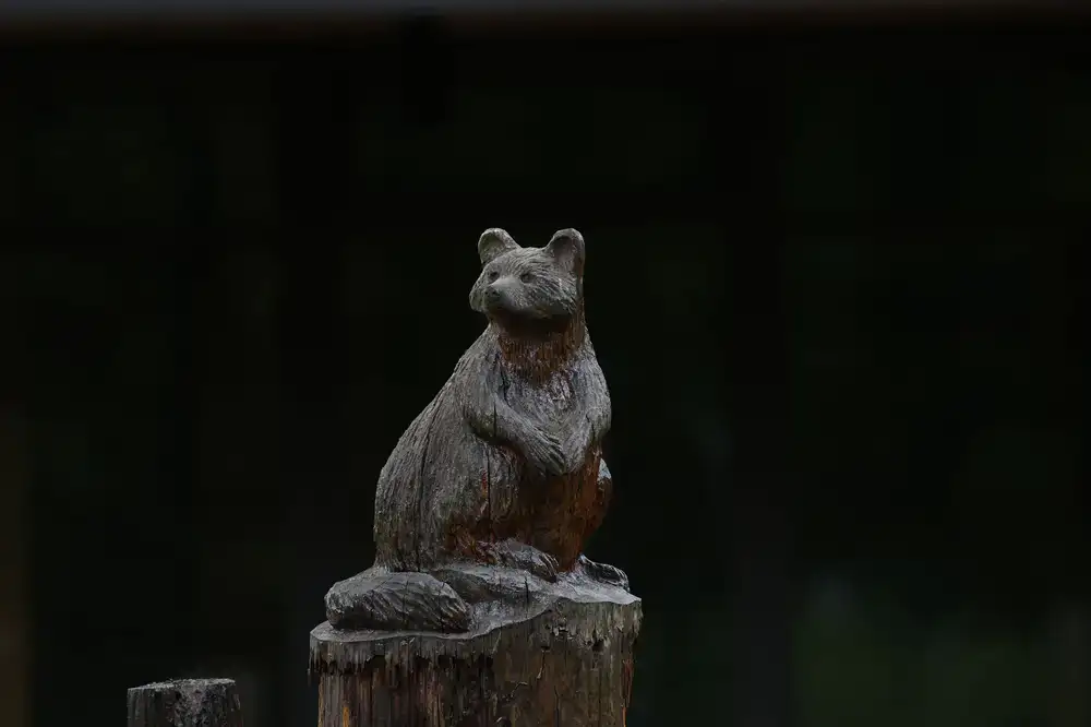 Carved wooden forest animals including a bear and a fox