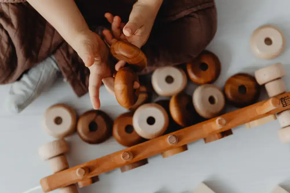 Smooth wooden teething rings and sensory rattles